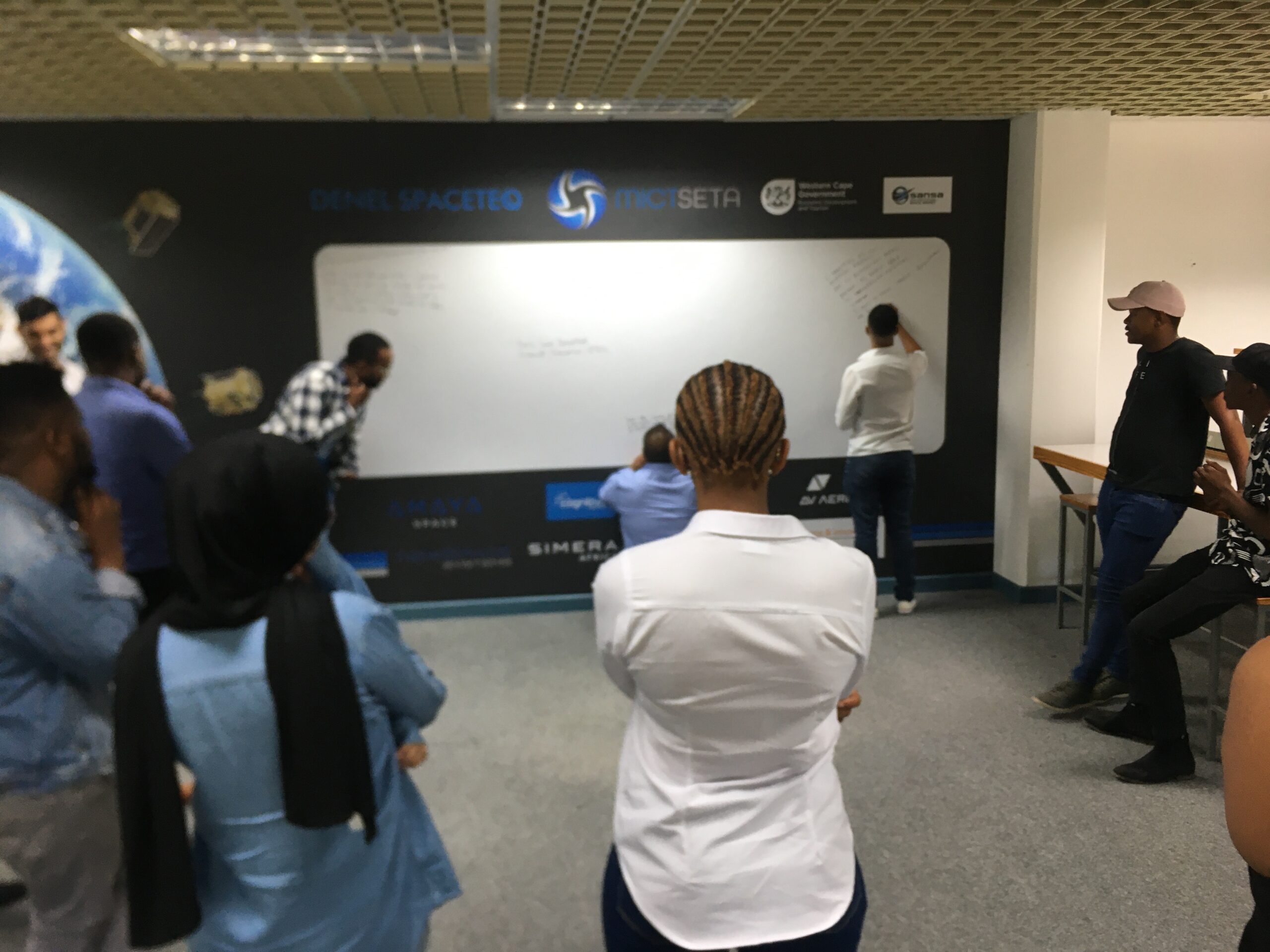 Interns writing down 1 goal they would like to achieve after the 12 months program. Photo Credit: Astrofica